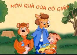 Các con ơi, hôm nay cô sẽ kể cho chúng mình nghe một câu chuyện rất hay, tên là “Món quà của cô giáo”. Các con cùng đoán xem, cô giáo tặng món quà gì cho các bạn nhỏ nhé!